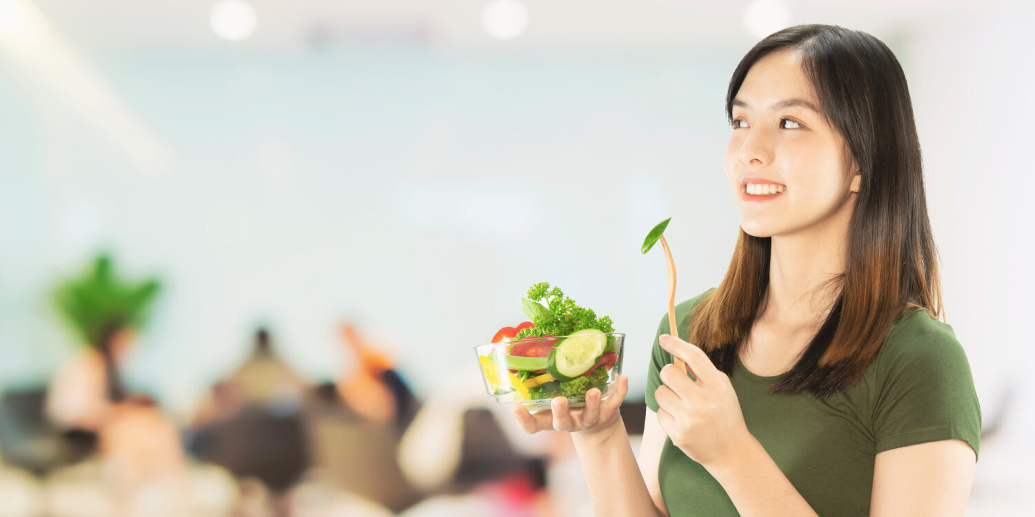 happy-lady-holding-kitchen-stuff-copy-space-background