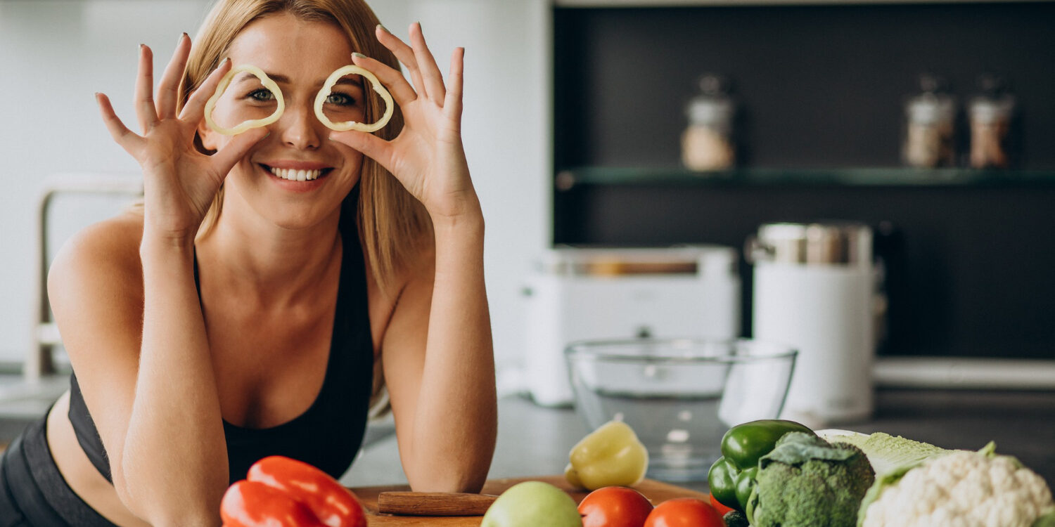 young-sporty-woman-with-pepper-kitchen
